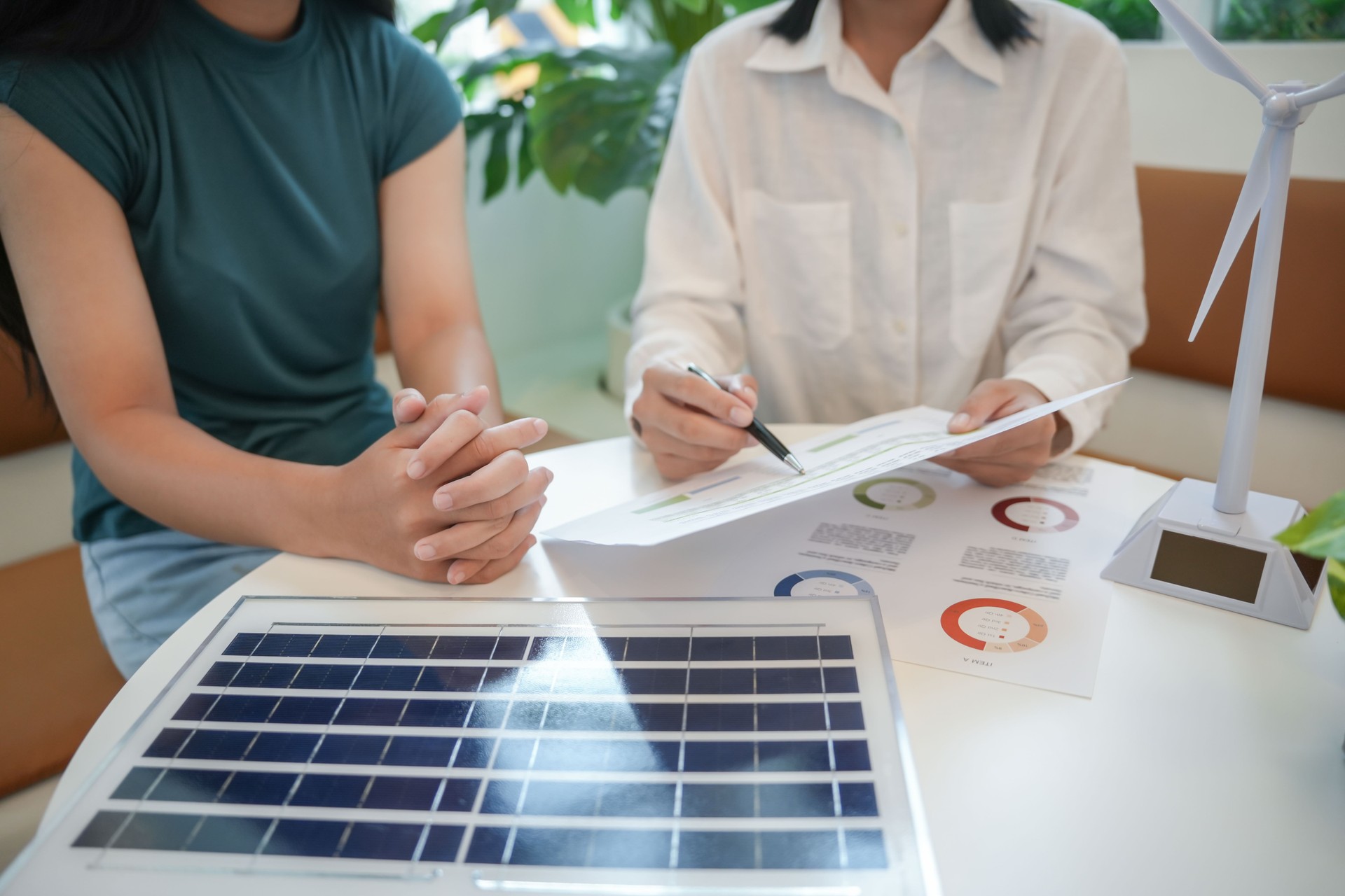 Solar panels green energy Business people working in green eco friendly office business meetingÂ creative ideas for business eco friendly professional teaching corporate people sustainable electricity